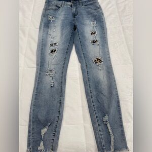 Distressed leopard print jeans